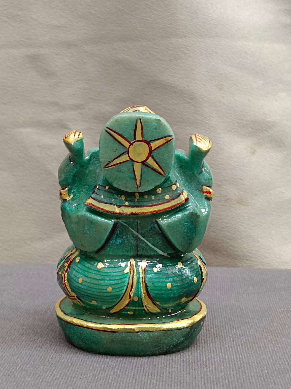 Hand-Painted Stone Ganesh Idol – Green & Gold