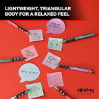 Colorful pens and sticky notes on a red background with Rotring branding.