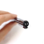 Close-up of a Rotring Tikky Graphic Fineliner with a 0.3mm tip, showing the pen's tip and a hand holding it.