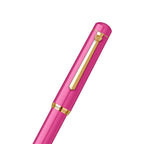 scrikss 419 medium nib Pink fountain pen with gold accents on a white background