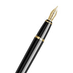 scrikss honour 38 medium nib glossy Black fountain pen with gold accents on a white background