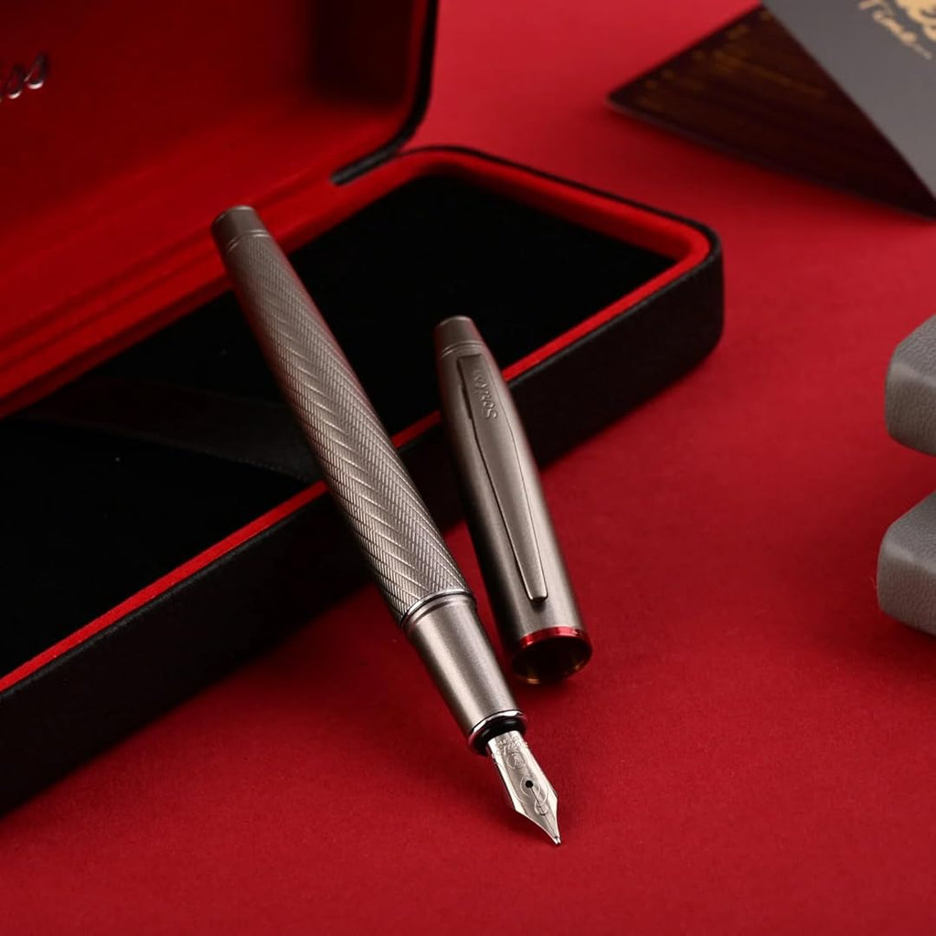Scrikss Noble 35 Medium nib Fountain Pen in Matte Titanium on a red and black open box