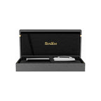 Scrikss pen set in a black display case on a white background